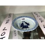 A CHINESE BLUE AND WHITE SMALL DISH PAINTED WITH AN IMMORTAL