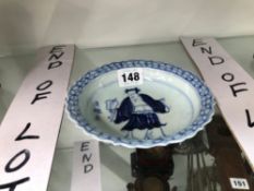 A CHINESE BLUE AND WHITE SMALL DISH PAINTED WITH AN IMMORTAL
