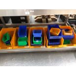 A COLLECTION OF PLASTIC STORAGE TRAYS IN VARIOUS SIZES