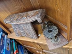 A MIDDLE EASTERN DOOR KNOCKER TOGETHER WITH A CARVED WOOD STOOL