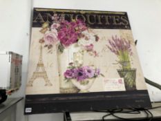 A PARISIAN FLORAL PAINTING ON CANVAS HEADED ANTIQUITES