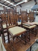 A SET OF SIX OAK DINING CHAIRS.
