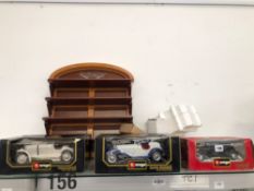 THREE BOXED BURAGO DIE CAST TOYS, A DISCOVERY FORK LIFT TRUCK AND A TIN PLATE INTERCONTINENTAL