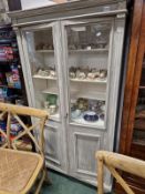 A FRENCH PAINTED PINE GLAZED BOOKCASE.