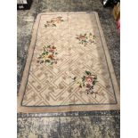 A KNOTTED FLORAL PATTERN RUG. 239 x 150cms