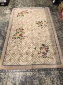A KNOTTED FLORAL PATTERN RUG. 239 x 150cms