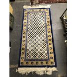 A GOOD QUALITY CHINESE RUG OF UNUSUAL DESIGN