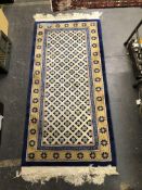 A GOOD QUALITY CHINESE RUG OF UNUSUAL DESIGN