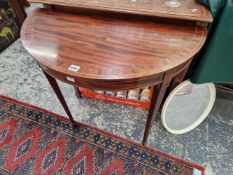 A 20th C. LINE INLAID MAHOGANY DEMILUNE TABLE TOGETHER WITH A ROUND MIRROR IN A WHITE PLASTIC