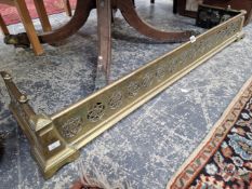 A BRASS FIRE KERB PIERCED WITH STAR ROUNDELS