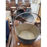 A COPPER COAL SCUTTLE WITH SHOVEL AND TOGETHER WITH A BRASS JAM PAN