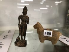 A BURMESE BRONZE FIGURE OF A MAN TOGETHER WITH A STONE CARVING OF A HORSE