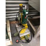 A BOSCH POF 600 ACE DRILL ON ADJUSTABLE STAND