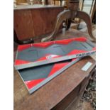 TWO ALUMINIUM AND RED PERSPEX TRAYS LABELLED TAGHEUER