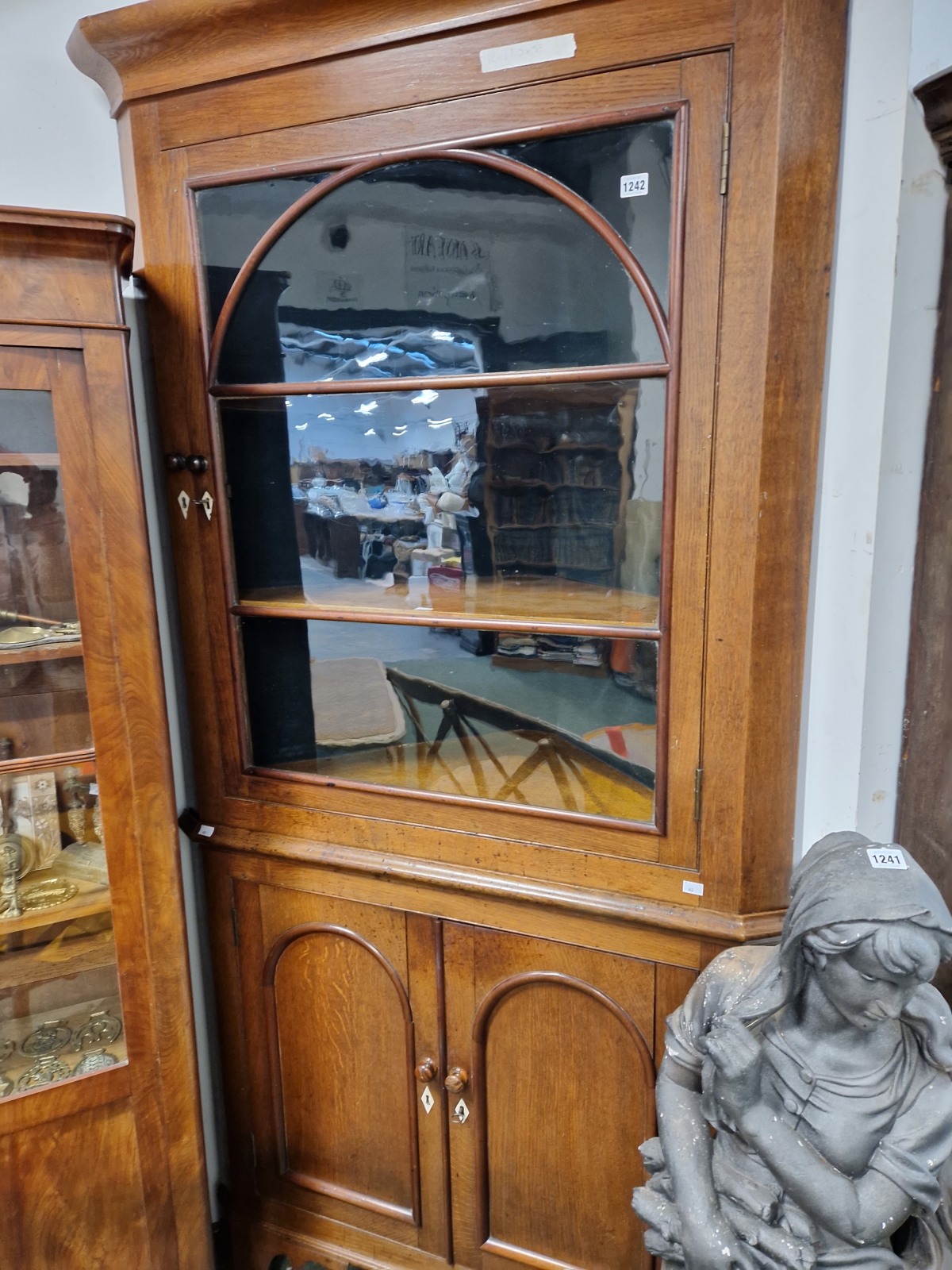 A LARGE 19th C. OAK GLAZED TOP TWO PART CORNER CABINET.