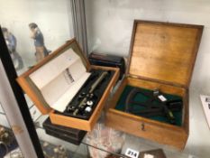 A CASED SEXTANT, A CASED ALLBRIT PLANIMETER, A METAL CASED GEOMETRY SET AND A MECCANO NO. 1 CLOCK