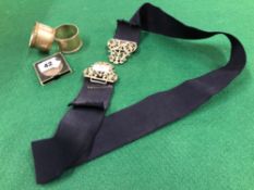 TWO HALLMARKED SILVER NAPKIN RINGS, A VICTORIAN CROWN AND A HALLMARKED BELT BUCKLE.