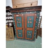 AN EAST EUROPEAN PAINTED TWO DOOR CABINET. 165 X 143 X 67CMS.