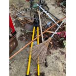 A POST HOLE DIGGER AND VARIOUS OTHER GARDEN IMPLEMENTS