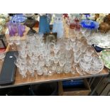 A CUT GLASS PART SET OF DRINKING GLASS, OTHER GLASS, A CLOCK, A CASED CARVING SET AND DECORATIVE