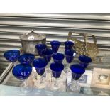 THIRTEEN BLUE BOWLED DRINKING GLASSES, AN ELECTROPLATE WINE BOTTLE CRADLE TOGETHER WITH A BISCUIT