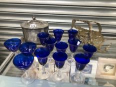 THIRTEEN BLUE BOWLED DRINKING GLASSES, AN ELECTROPLATE WINE BOTTLE CRADLE TOGETHER WITH A BISCUIT