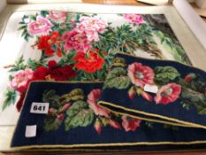 A CHINESE SILK NEEDLE WORK FLORAL SCROLL TOGETHER WITH A BLUE GROUND WOOL BELL PULL PANEL WORKED