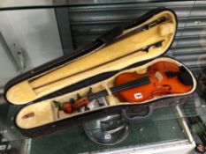 A CASED NYOJEONG KOREAN VIOLIN TOGETHER WITH TWO BOWS