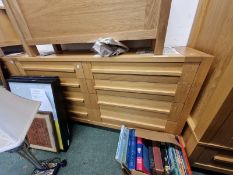 A PAIR OF OAK EIGHT DRAWER CHESTS.