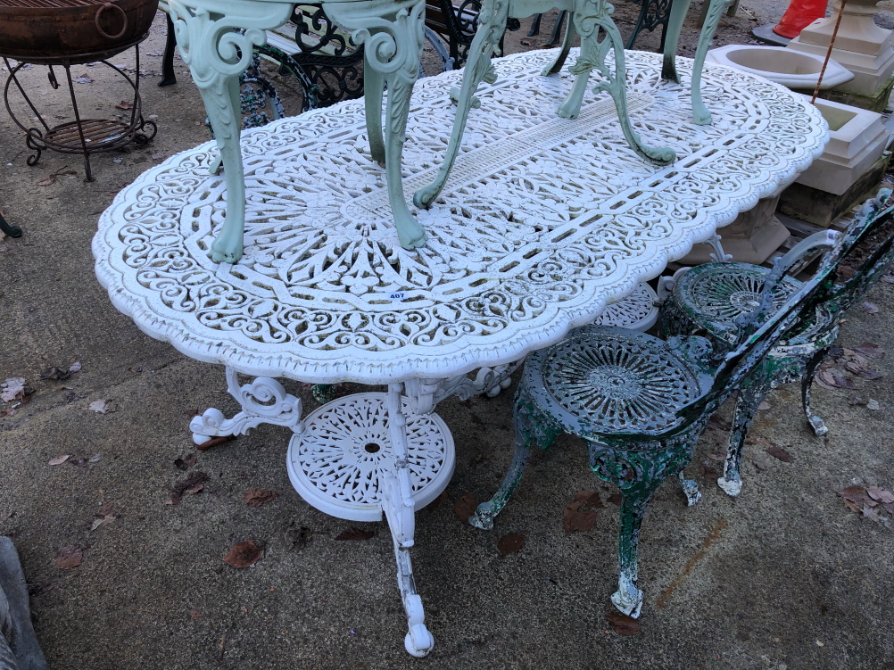 A WHITE PAINTED CAST ALLOY PATIO TABLE