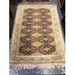 AN ORIENTAL RUG OF BOKHARA DESIGN. 180 x 121cms