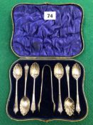 A CASED SET OF SILVER TEASPOONS AND SUGAR NIPS.