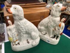 A RARE PAIR OF STAFFORDSHIRE SPANIELS WITH FIGURES.