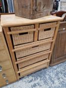 A NEST OF RATTAN DRAWERS. 94 X 63 X 45CMS.
