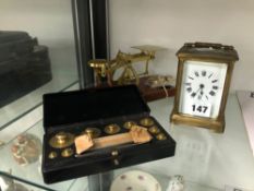 A CARRIAGE TIME PIECE, LETTER SCALES AND A CASE OF GRAM WEIGHTS