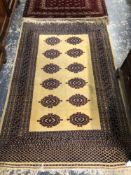 A PAIR OF ORIENTAL RUGS OF BOKHARA DESIGN. 200 x 132cms (2)