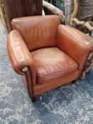 A LEATHER UPHOLSTERED TUB ARMCHAIR.