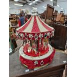 A CHILDRENS CHRISTMAS MERRY GO ROUND