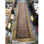 AN ANTIQUE PERSIAN SERAB RUNNER. 440 x 100cms