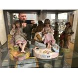 TWO ROBINSON AND LEADBETTER TINTED PARIN FIGURES TOGETHER WITH ANOTHER OF A GIRL LISTENING TO A