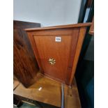 AN ANTIQUE BOAT HULL SMOKERS CABINET.