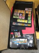 A QUANTITY OF WORLD STAMPS ON ALBUM LEAVES AND STOCK CARDS.