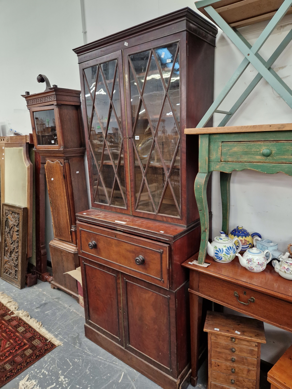 A GEORGE III MAHOGANY SECRETAIRE BOOKCASE WITH CABINET BASE FITTED WITH DRAWERS. 222 X 88 X 51CMS.