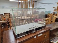 A GLASS AND CHROME TABLE TOP DISPLAY CABINET INSCRIBED MICHAEL KORS AND EMPORIO ARMANI