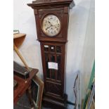 AN OAK LONGCASE CLOCK.