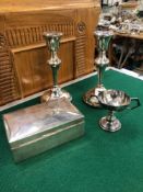 A PAIR OF HALLMARKED SILVER CANDLESTICKS, A CIGARETTE BOX AND A SMALL TROPHY CUP.