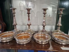 A SET OF FOUR PLATE ON COPPER CANDLESTICKS TOGETHER WITH TWO PAIRS OF WINE COASTERS