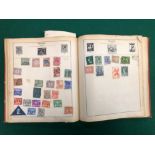 A VINTAGE STAMP ALBUM.