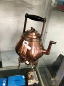 A VICTORIAN COPPER KETTLE, BURNER AND STAND
