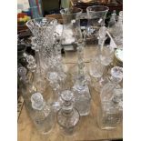 FIFTEEN GLASS DECANTERS, A VASE AND A PAIR OF STORM SHADES